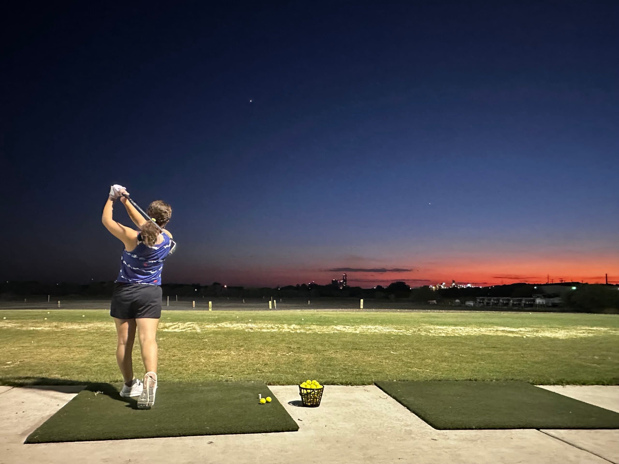 Junior golfer on the driving range